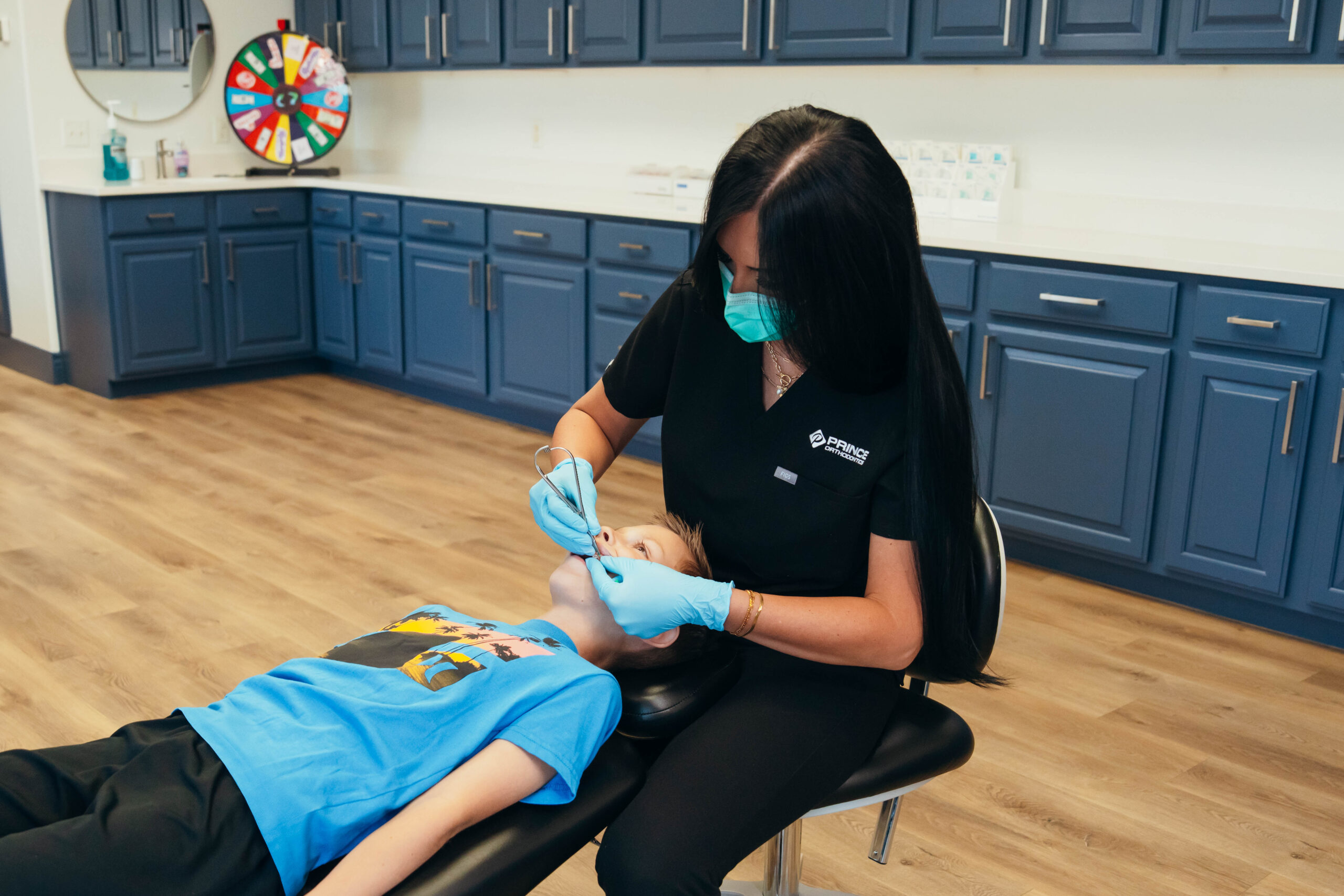 Prince Orthodontics employee working on kids braces near American Fork, Utah