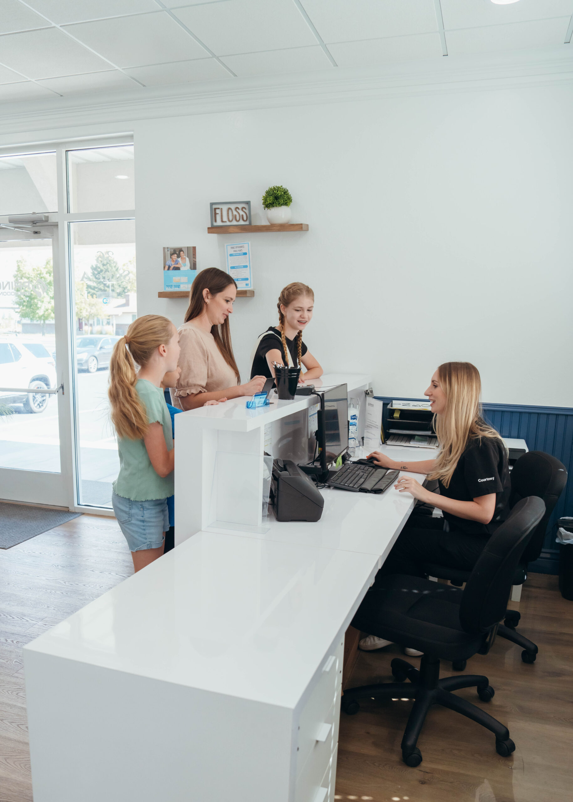 Happy family checking into same day appointment at Prince Orthodontics near American Fork, Utah
