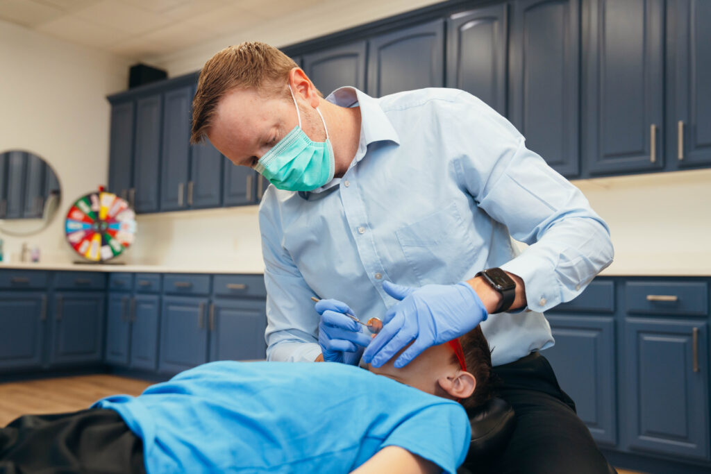 Dr. Steven Prince providing orthodontic treatment to a young patient at Prince Orthodontics in American Fork, Utah
