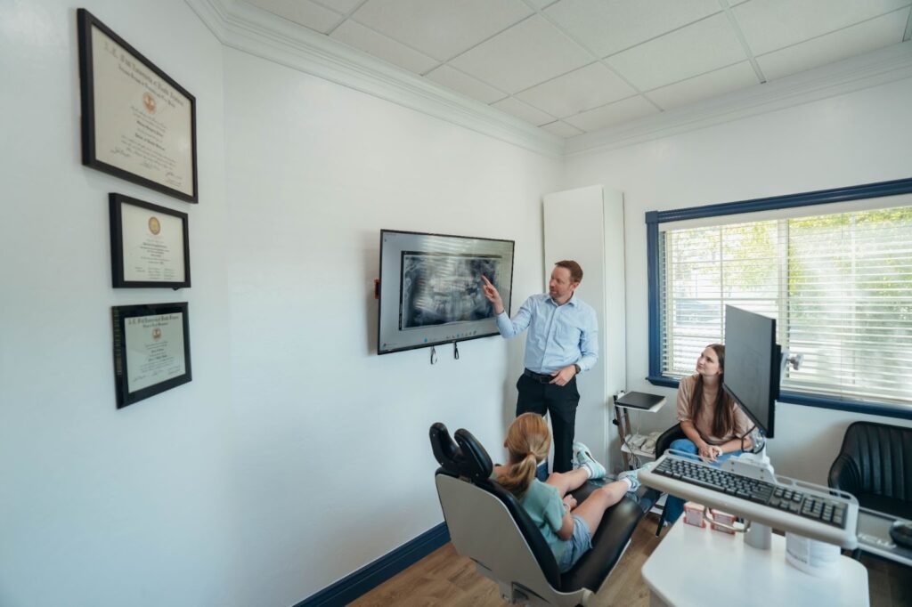 Dr. Steven Prince discussing a digital treatment plan with a patient in the American Fork office