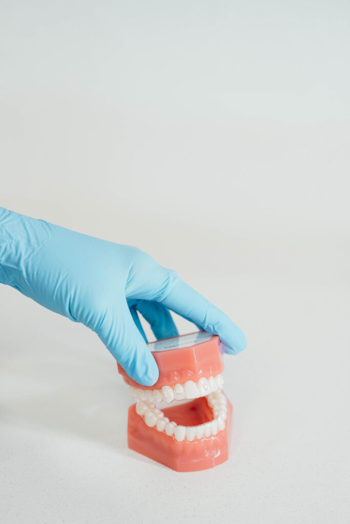 A demonstration of how braces fix bite.