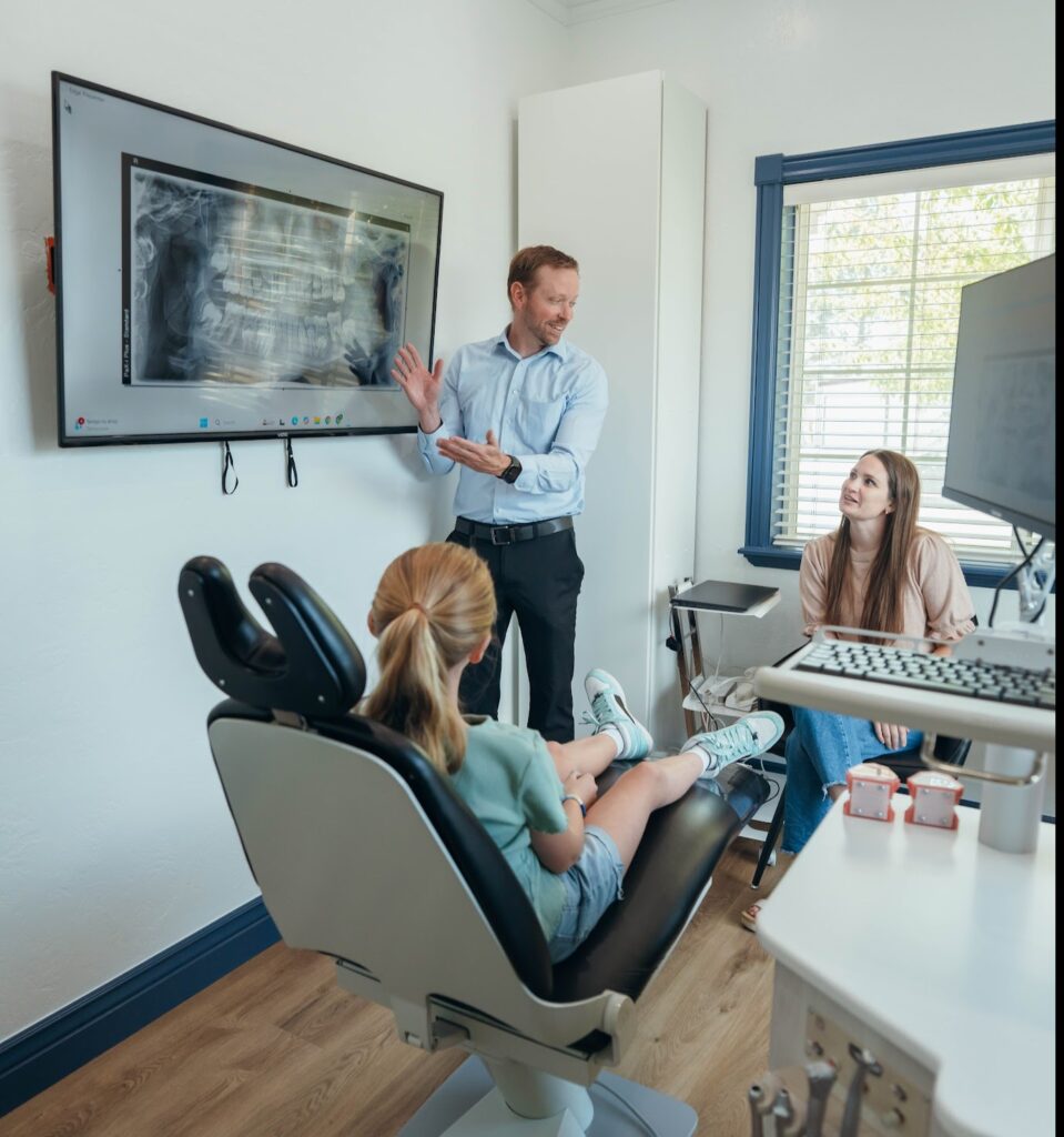 Dr. Prince explaining a tooth chart at Prince Orthodontics in American Fork, UT
